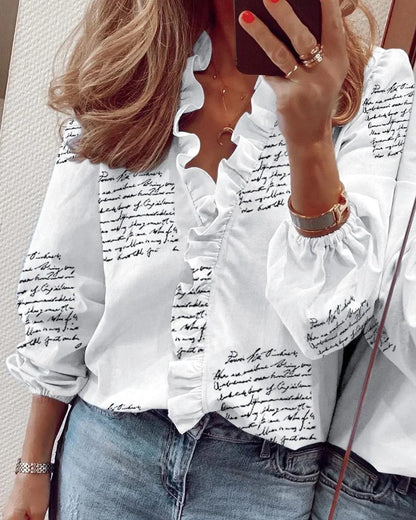 Enola | Charming blouse with playful ruffles