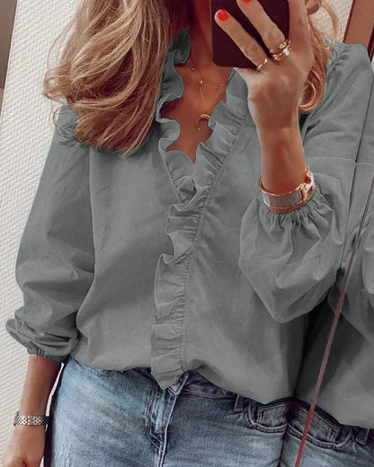 Enola | Charming blouse with playful ruffles