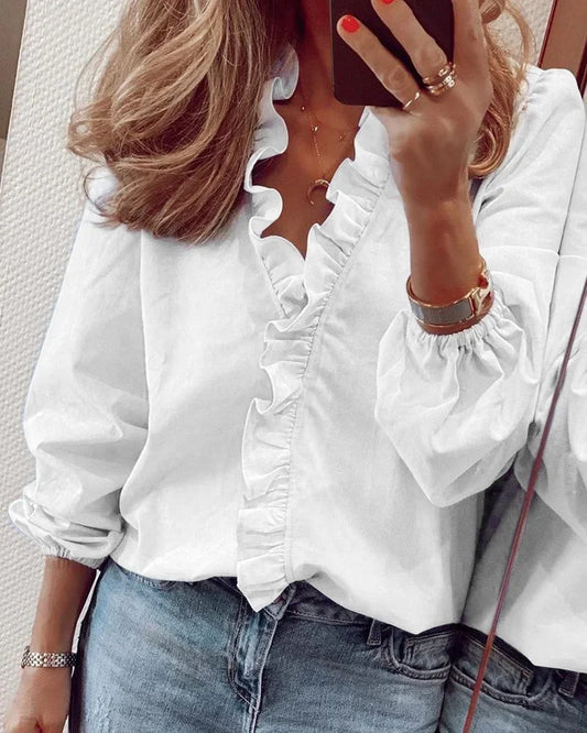 Enola | Charming blouse with playful ruffles